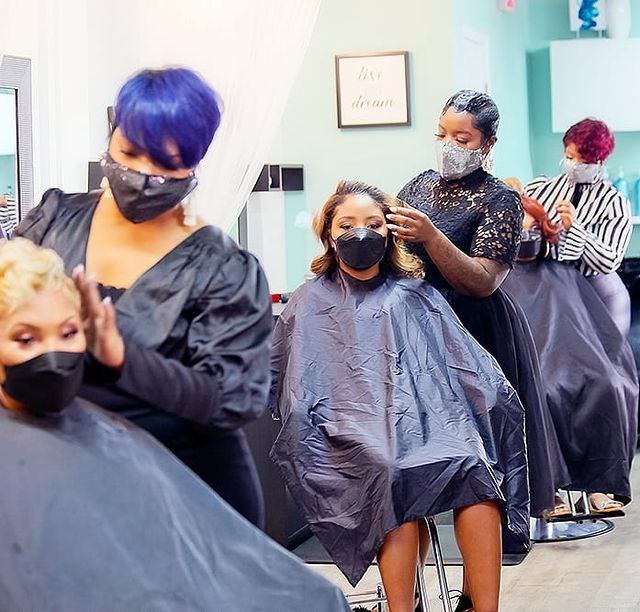 Image of a group of women having their hair done