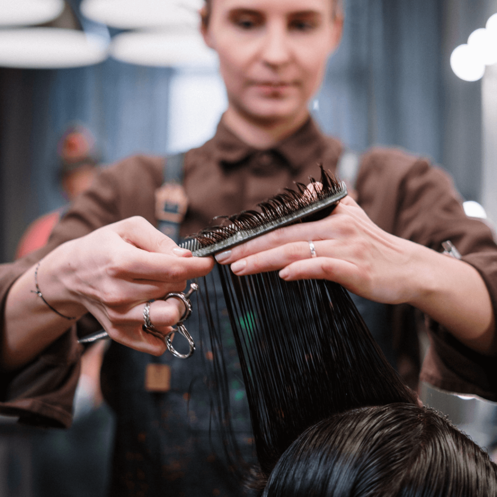 Image of hairstylist cutting hair