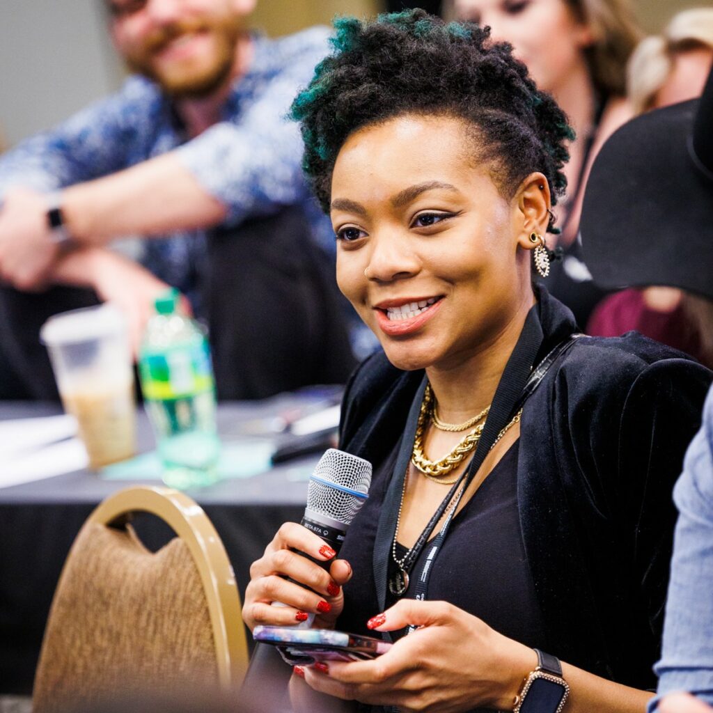 Image of woman holding a microphone