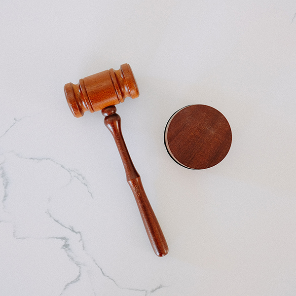 Wooden gavel on a marble table