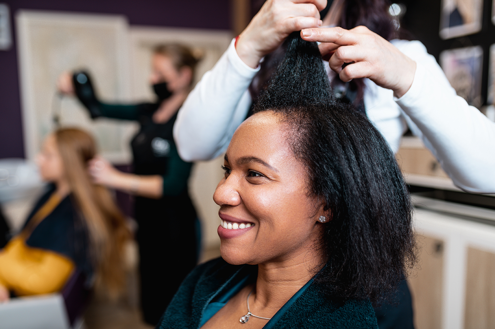 Image of a woman having her hair cut