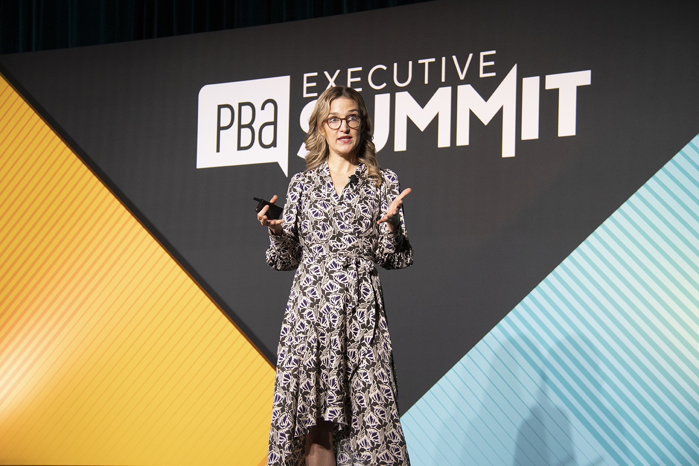 Image of a woman speaking at the executive summit