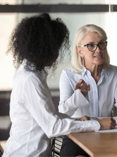 Image of two women speaking