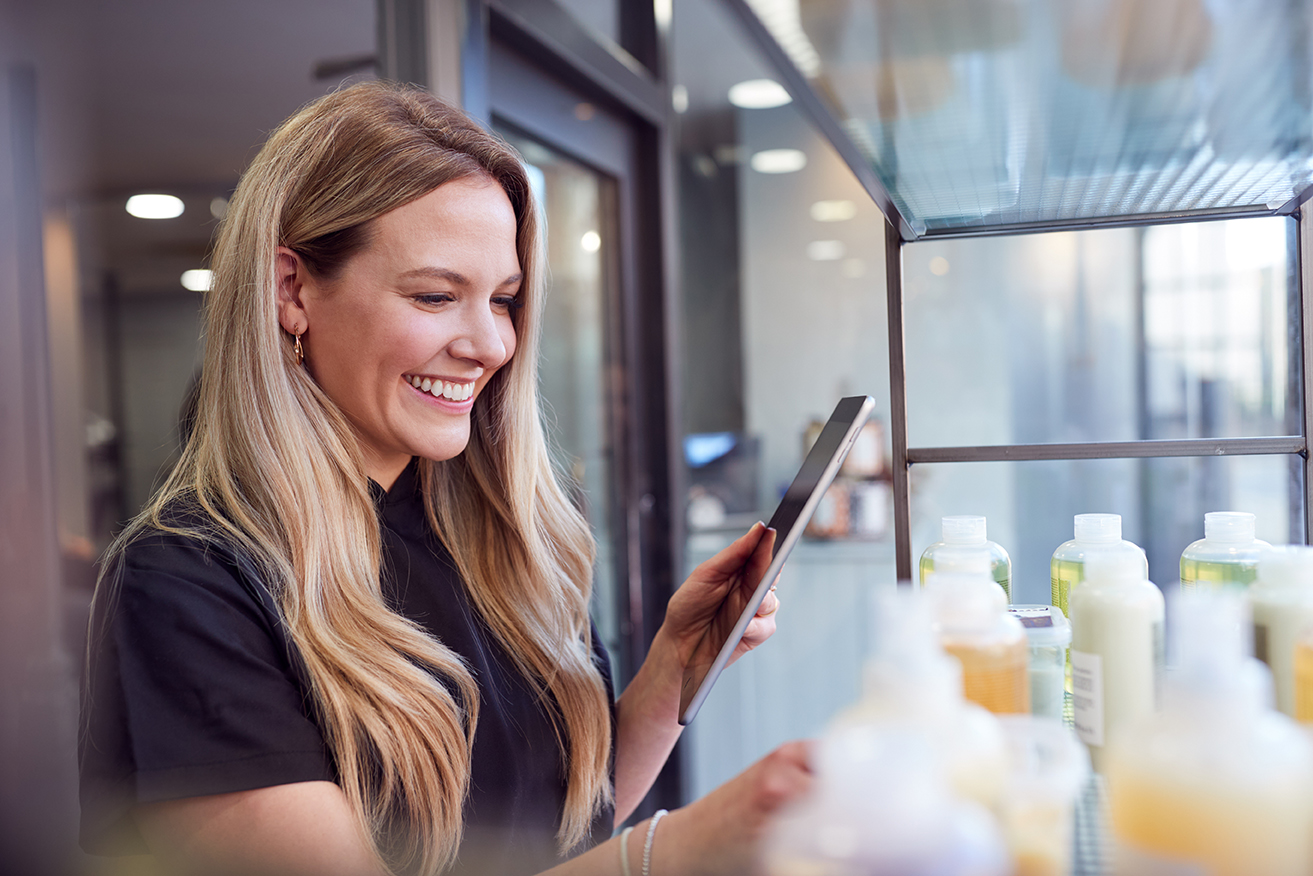 Image of a woman smiling at product