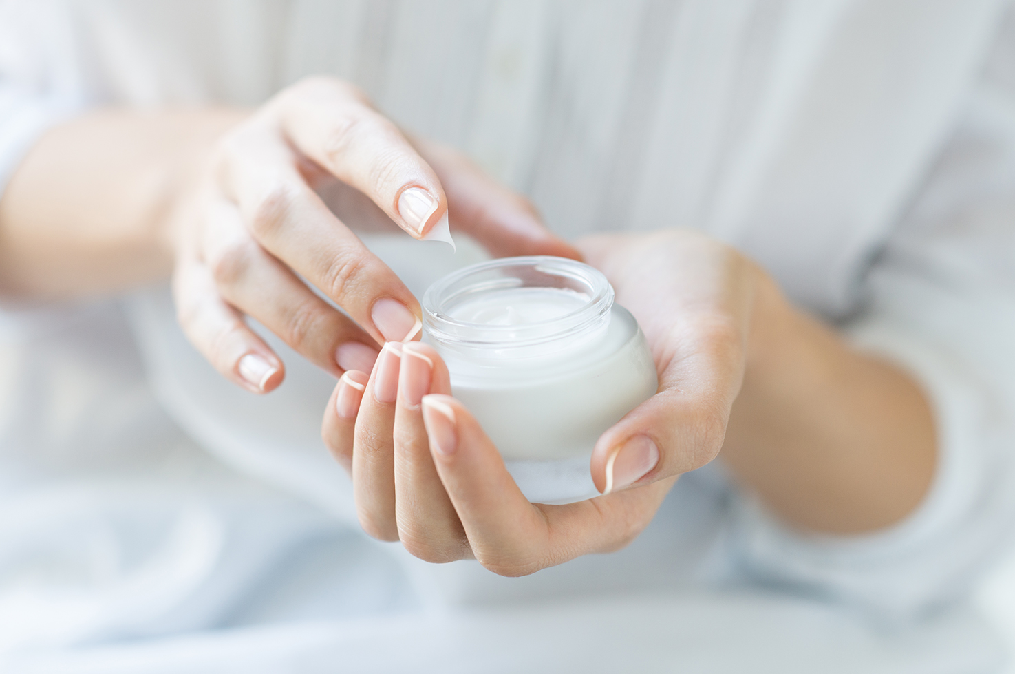 Image of a person holding creme