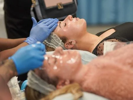 Image of people receiving cosmetic treatment